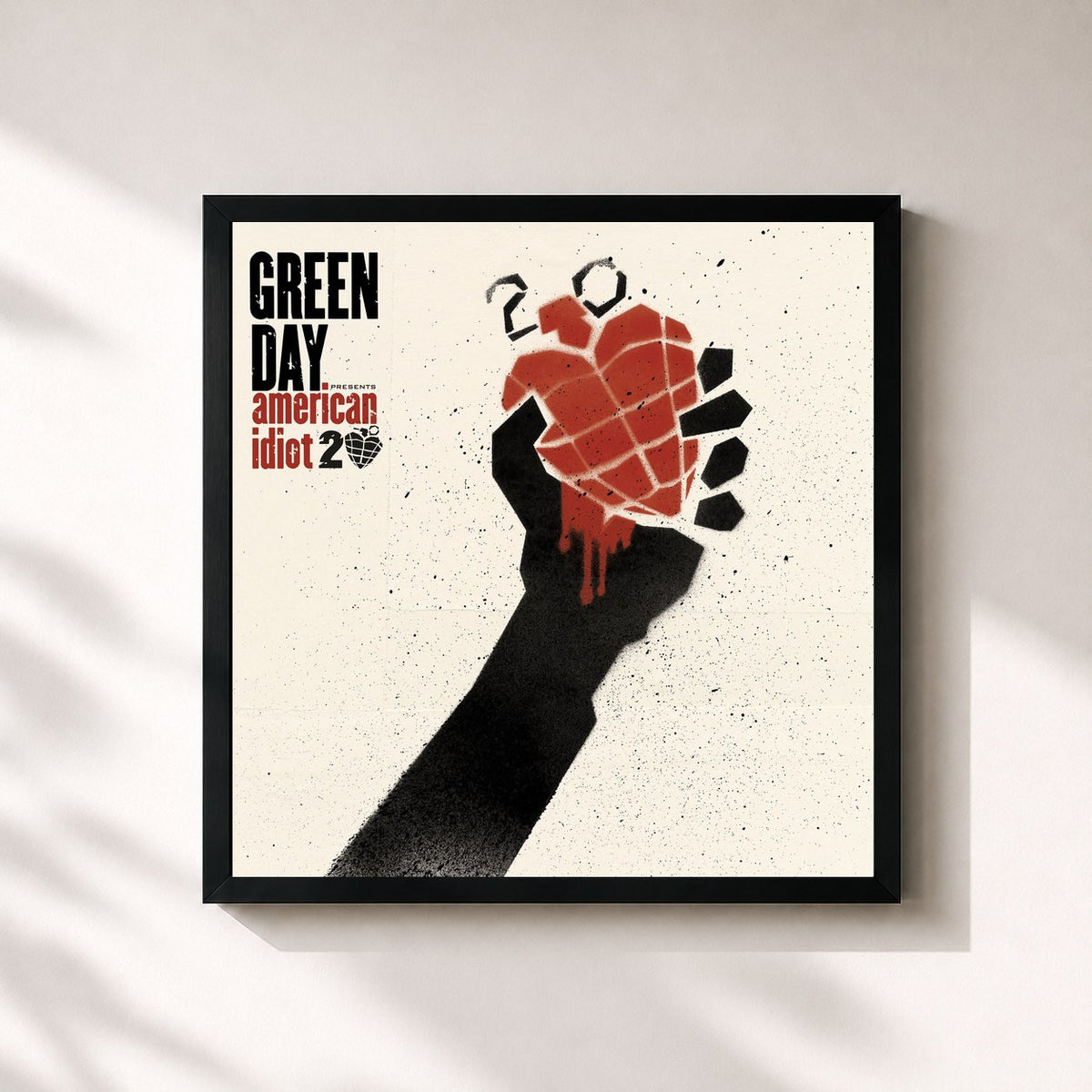 #noir American Idiot (20th Anniversary Deluxe Edition) de Green Day en lámina cuadrada enmarcada, marco negro de 32x32 cm