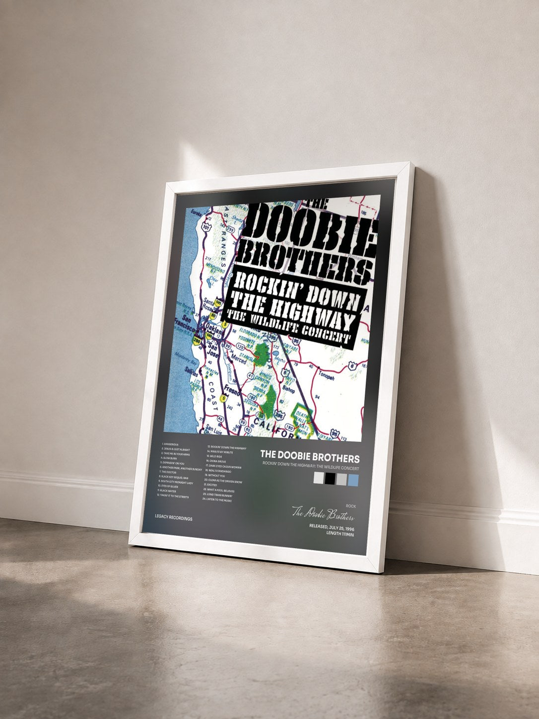 #blanc Tableau de l'album Rockin' Down The Highway: The Wildlife Concert de The Doobie Brothers vu de trois quarts, cadre blanc