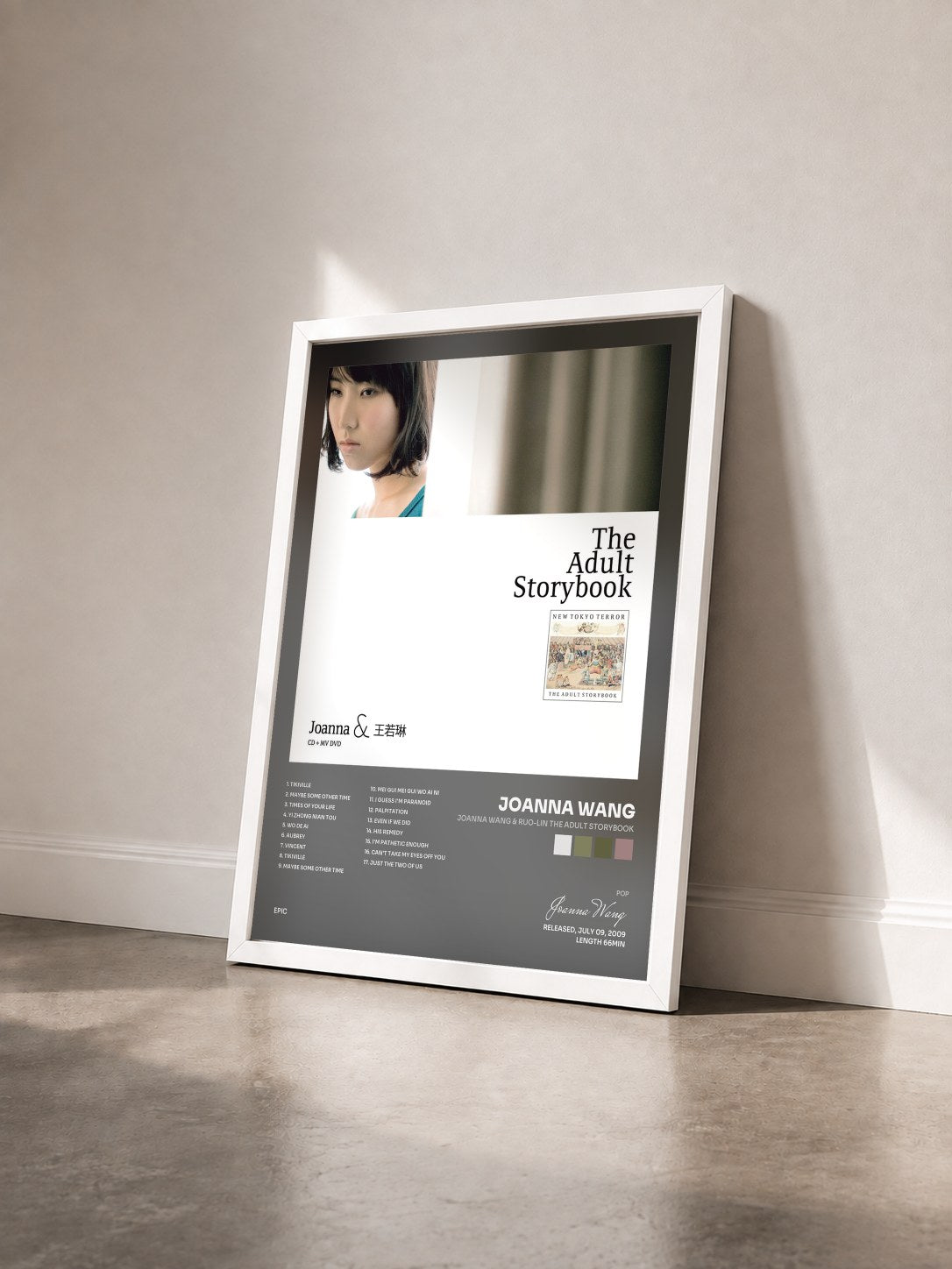 #blanc Tableau de l'album Joanna Wang & Ruo-Lin The Adult Storybook de Joanna Wang vu de trois quarts, cadre blanc
