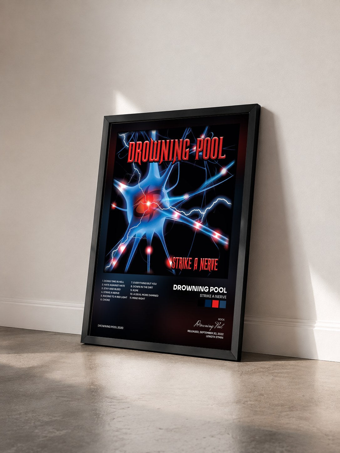 #noir Tableau de l'album Strike A Nerve de Drowning Pool vu de trois quarts, cadre noir