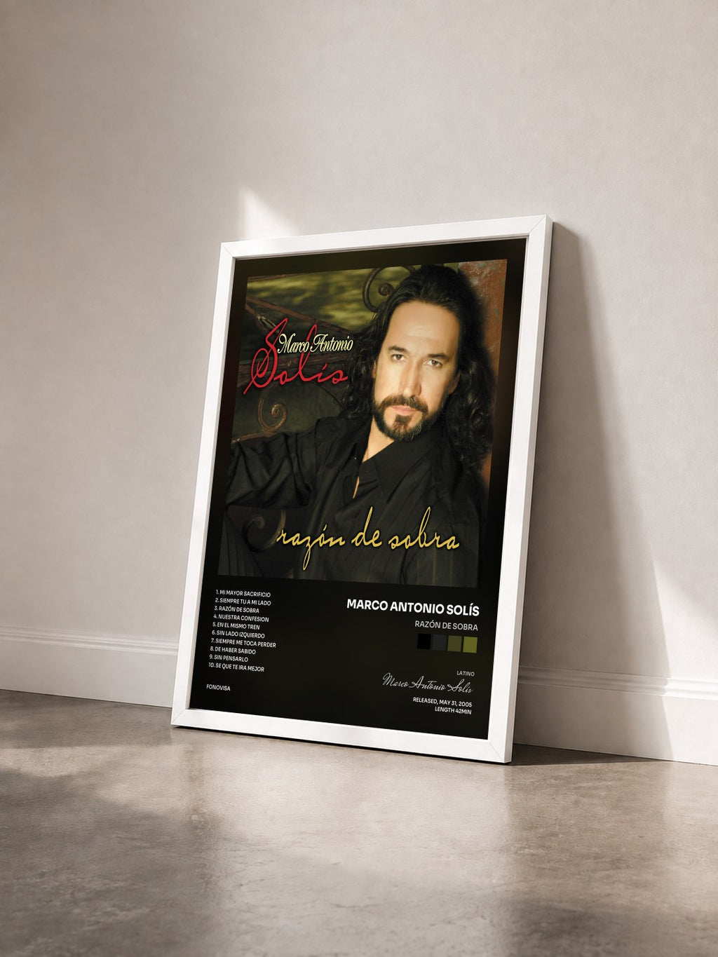 #blanc Tableau de l'album Razón De Sobra de Marco Antonio Solís vu de trois quarts, cadre blanc