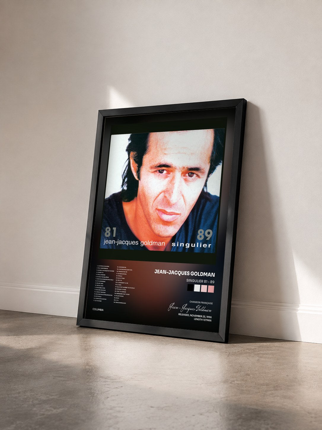 #noir Singulier 81 - 89 by Jean-Jacques Goldman as a framed art print seen at an angle, black frame