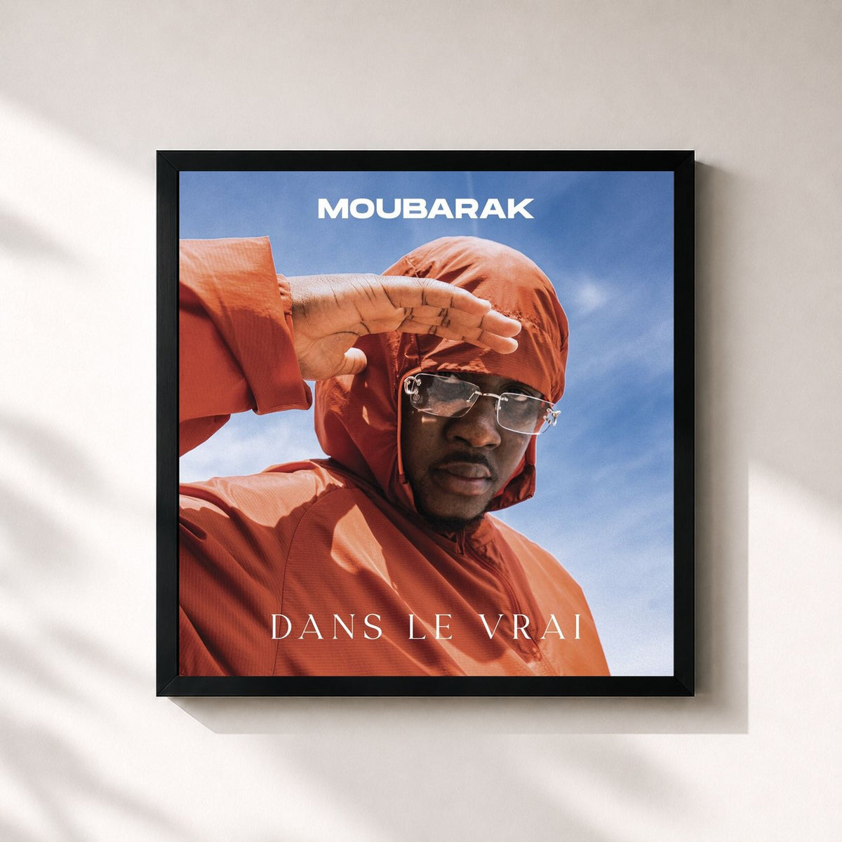 #noir Tableau carré de l'album Dans le vrai de Moubarak, cadre noir 32x32 cm