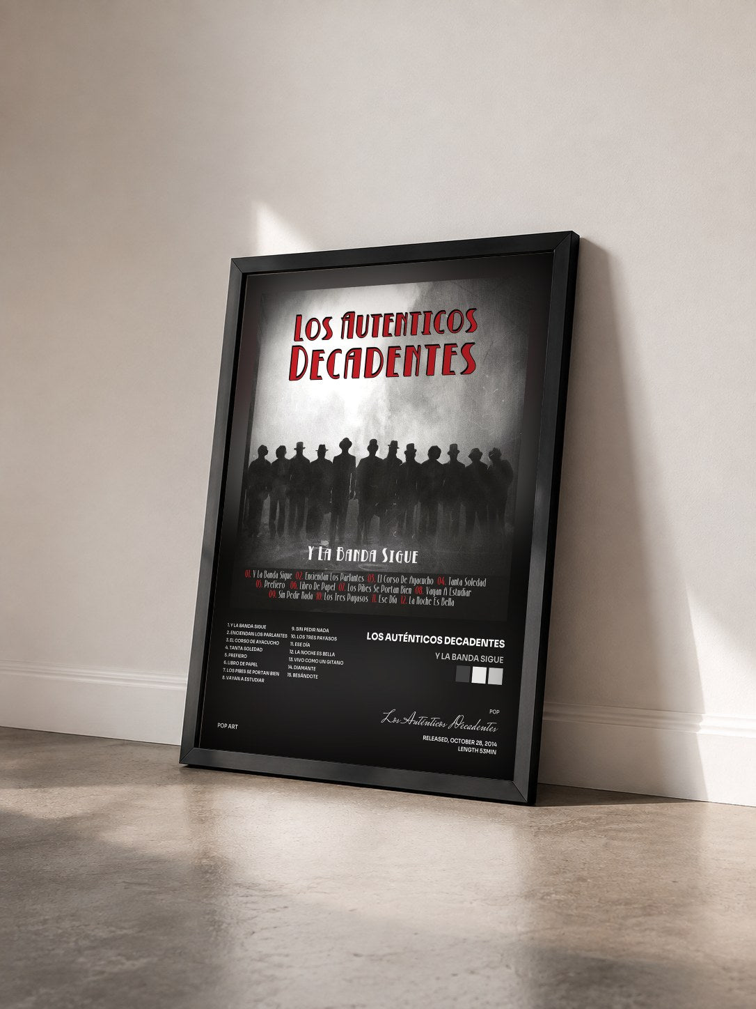 #noir Tableau de l'album Y la Banda Sigue de Los Auténticos Decadentes vu de trois quarts, cadre noir