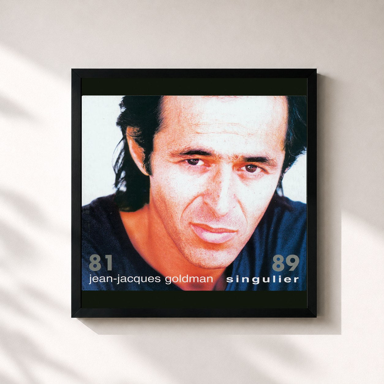 #noir Singulier 81 - 89 by Jean-Jacques Goldman as a square framed art print, black 32x32 cm frame