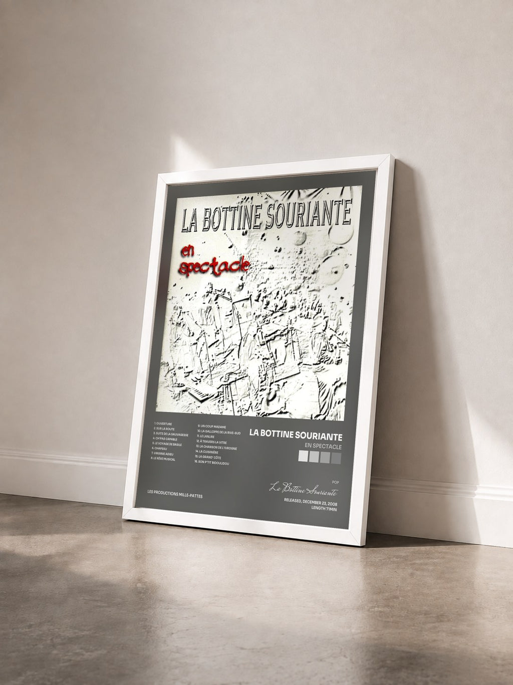 #blanc En spectacle by La Bottine Souriante as a framed art print seen at an angle, white frame