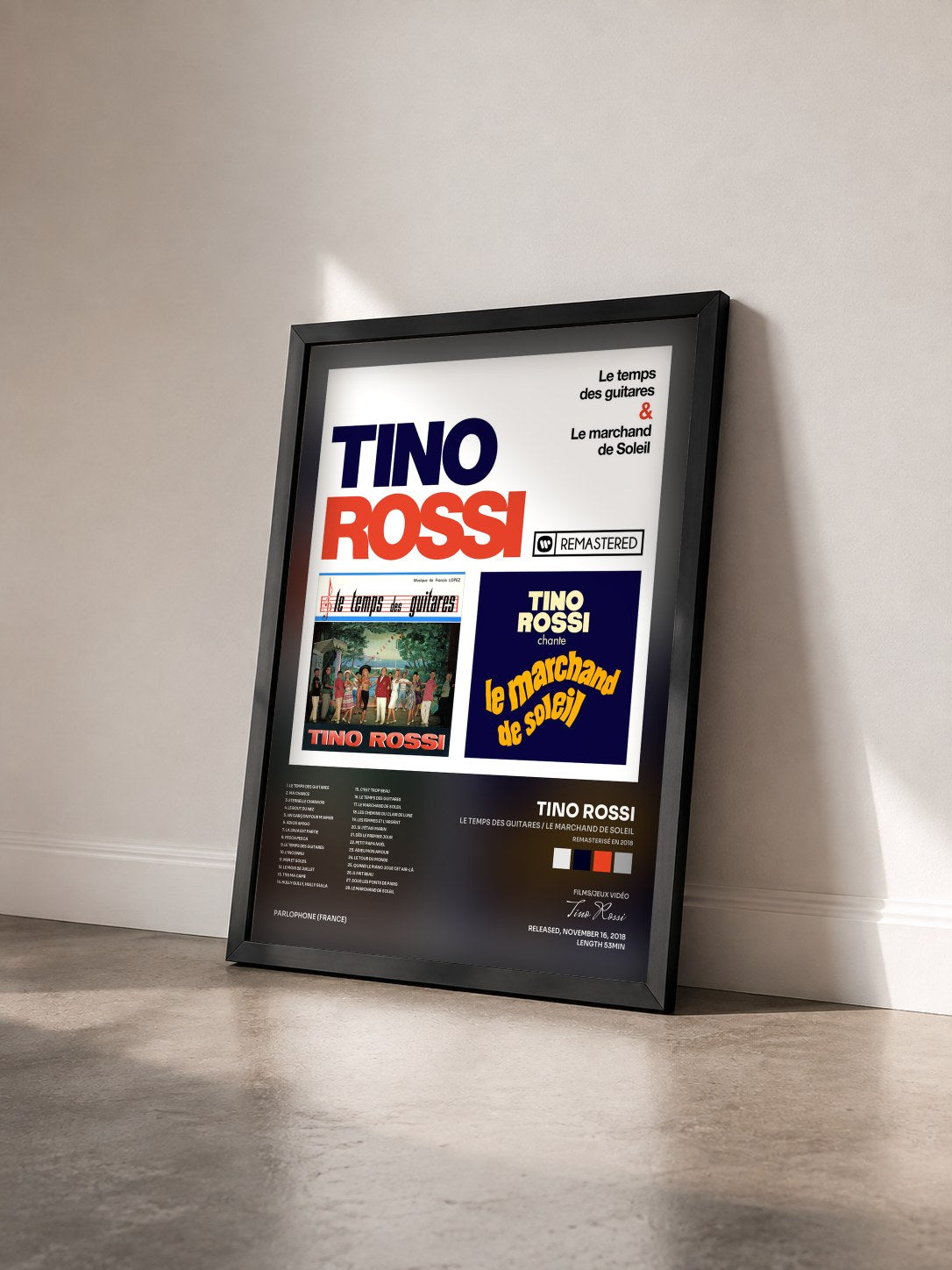 #noir Tableau de l'album Le temps des guitares / Le marchand de soleil (Remasterisé en 2018) de Tino Rossi vu de trois quarts, cadre noir