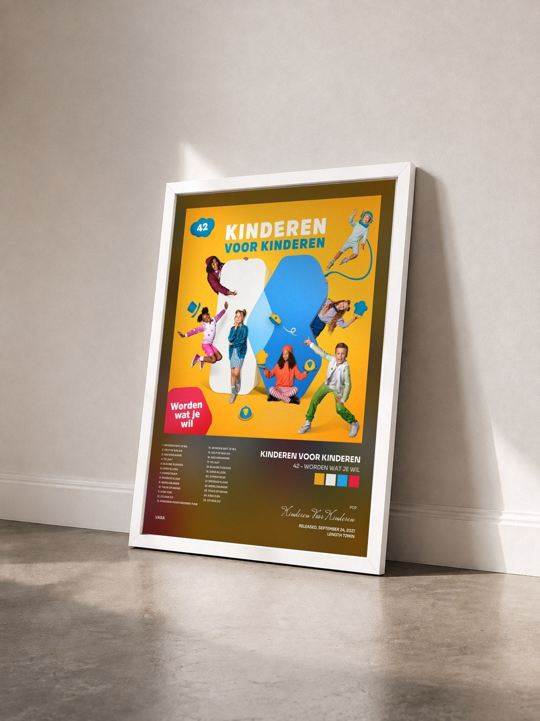 #blanc Tableau de l'album 42 - Worden wat je wil de Kinderen Voor Kinderen vu de trois quarts, cadre blanc