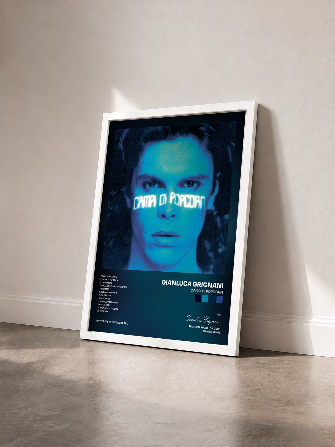 #blanc Tableau de l'album Campi Di Popcorn de Gianluca Grignani vu de trois quarts, cadre blanc