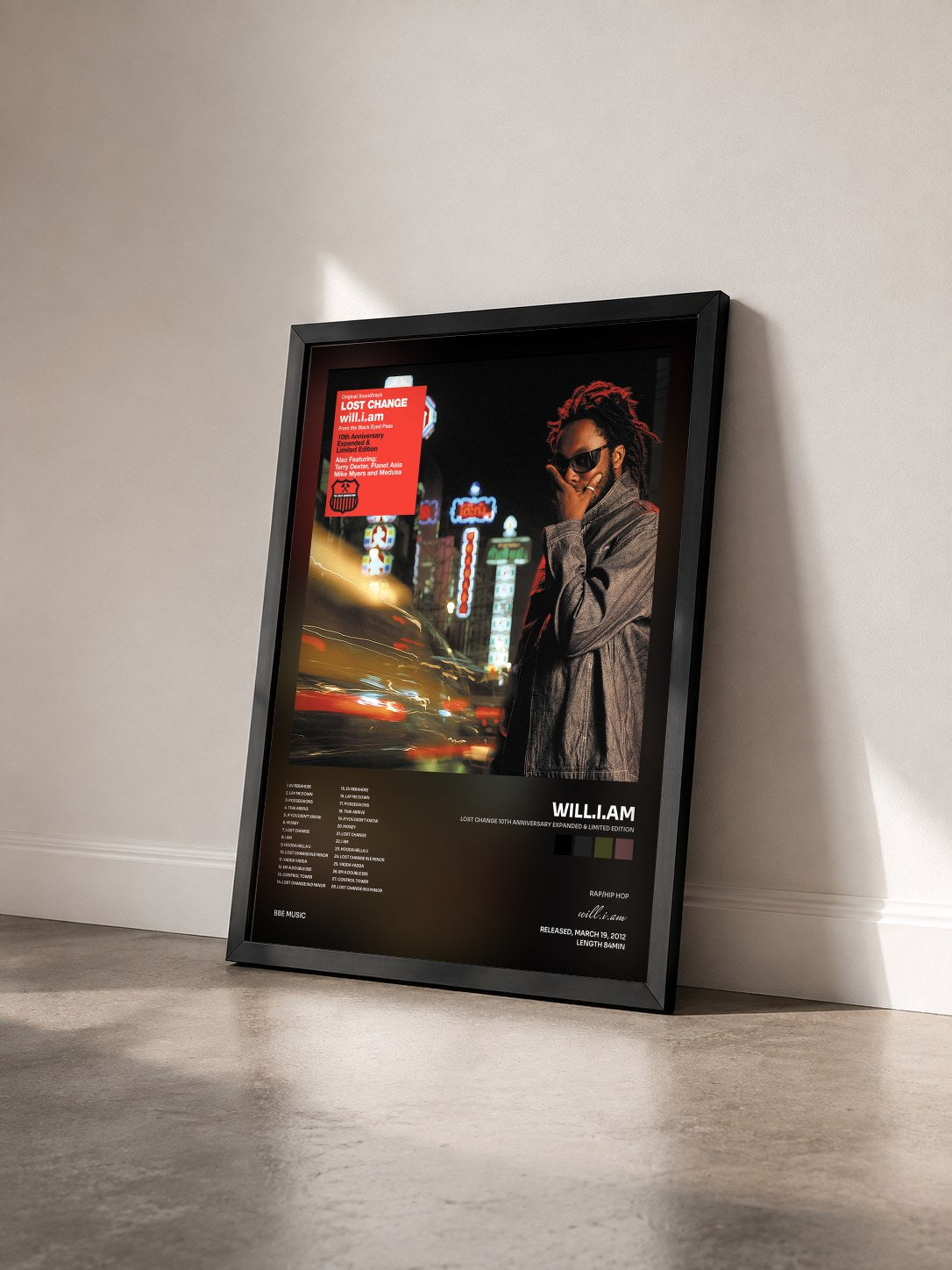 #noir Lost Change 10th Anniversary Expanded & Limited Edition by will.i.am as a framed art print seen at an angle, black frame