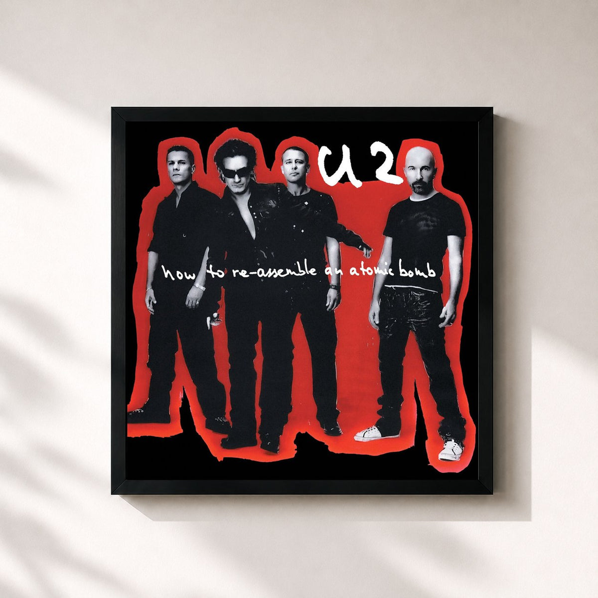 #noir Tableau carré de l'album How To Re-Assemble An Atomic Bomb de U2, cadre noir 32x32 cm