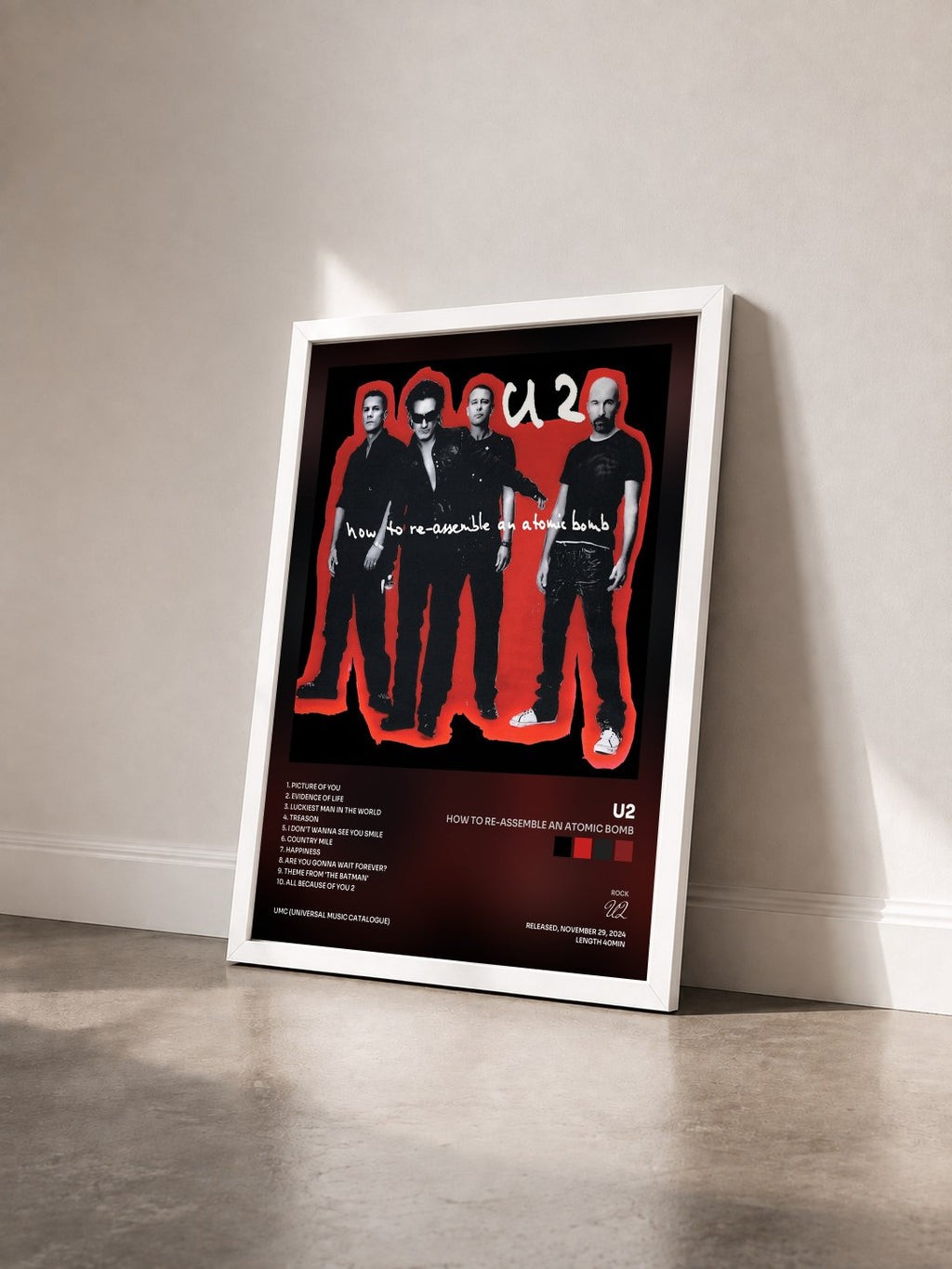 #blanc How To Re-Assemble An Atomic Bomb by U2 as a framed art print seen at an angle, white frame