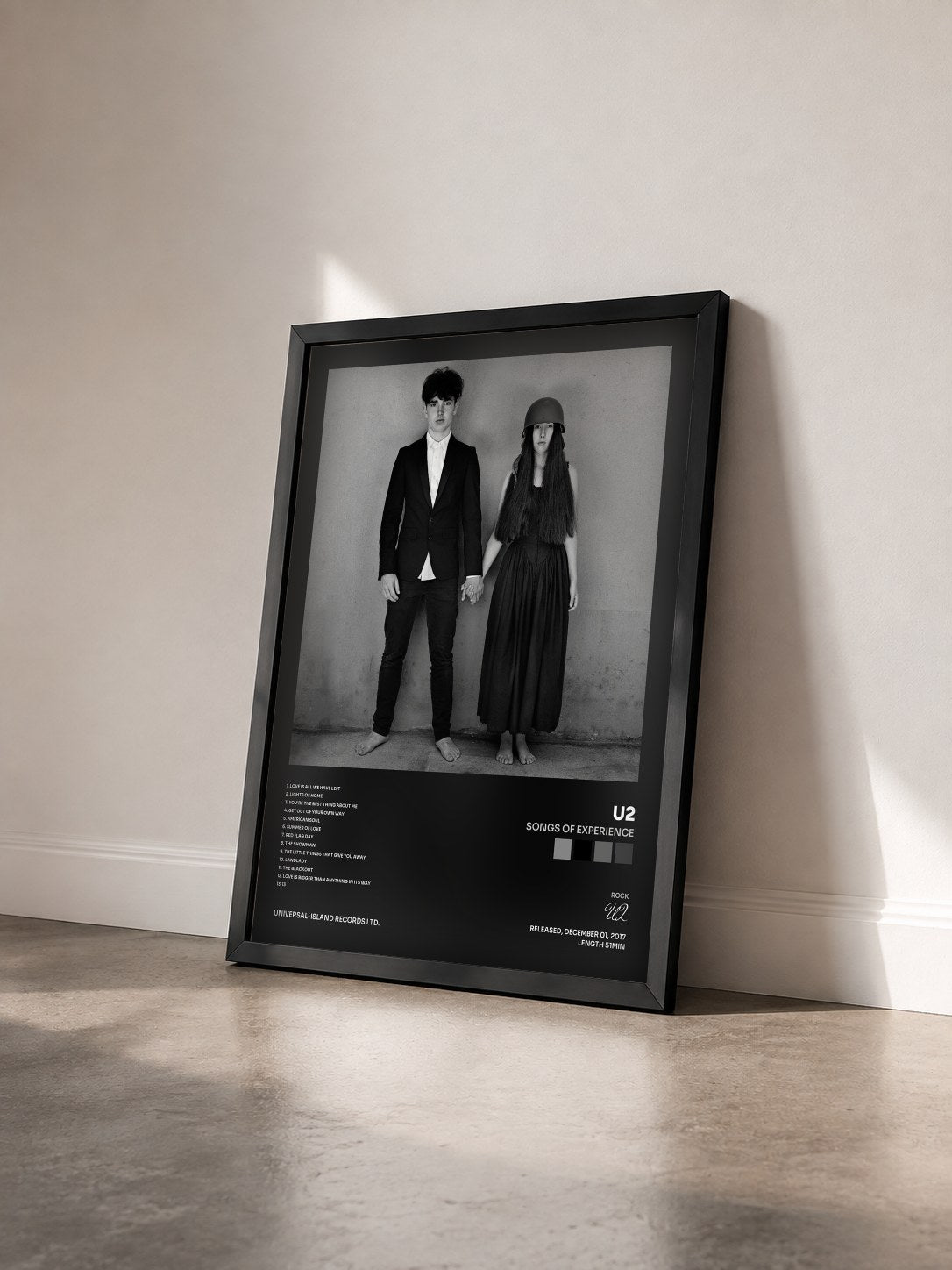 #noir Tableau de l'album Songs Of Experience de U2 vu de trois quarts, cadre noir