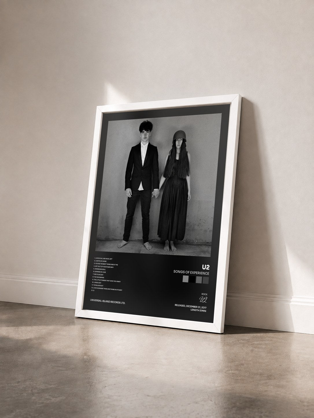 #blanc Tableau de l'album Songs Of Experience de U2 vu de trois quarts, cadre blanc