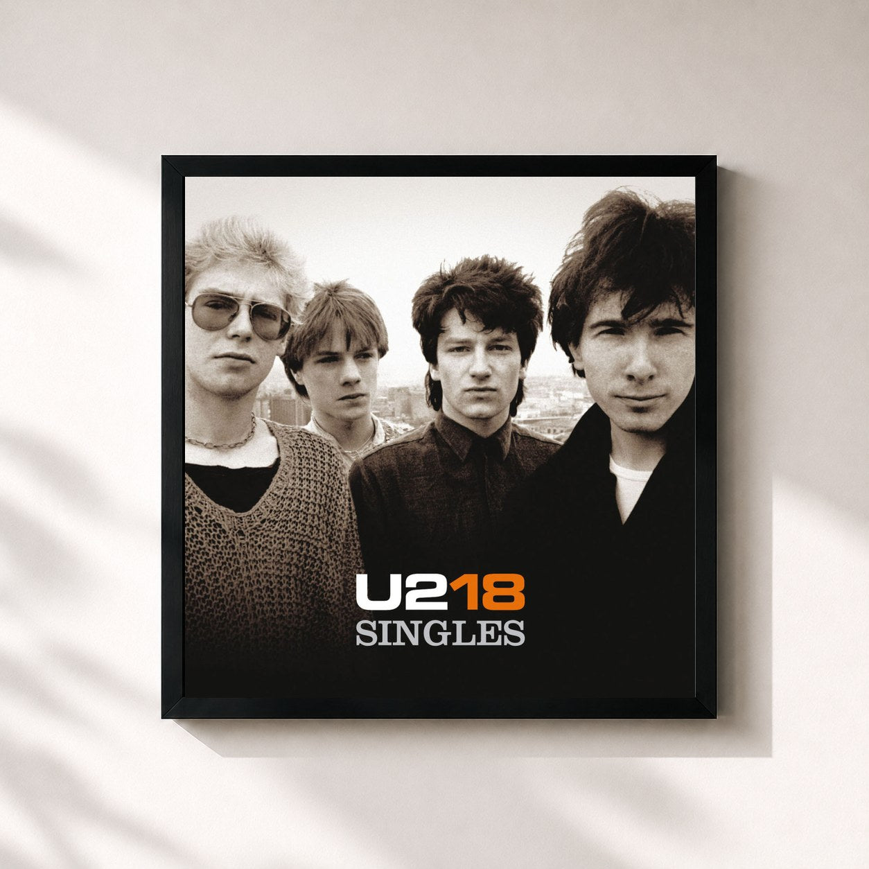 #noir U218 Singles de U2 en lámina cuadrada enmarcada, marco negro de 32x32 cm