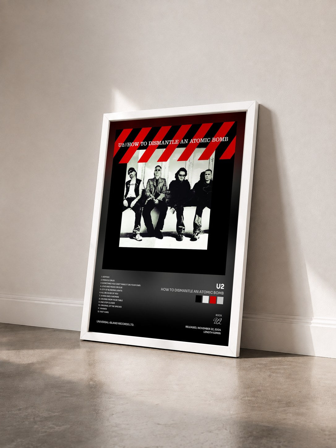 #blanc Tableau de l'album How To Dismantle An Atomic Bomb de U2 vu de trois quarts, cadre blanc