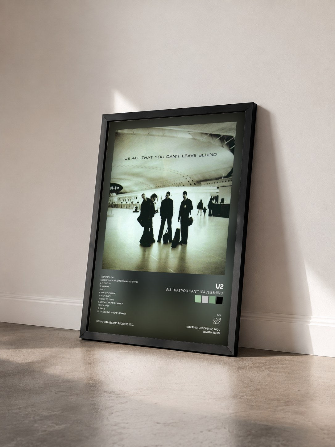 #noir Tableau de l'album All That You Can't Leave Behind de U2 vu de trois quarts, cadre noir