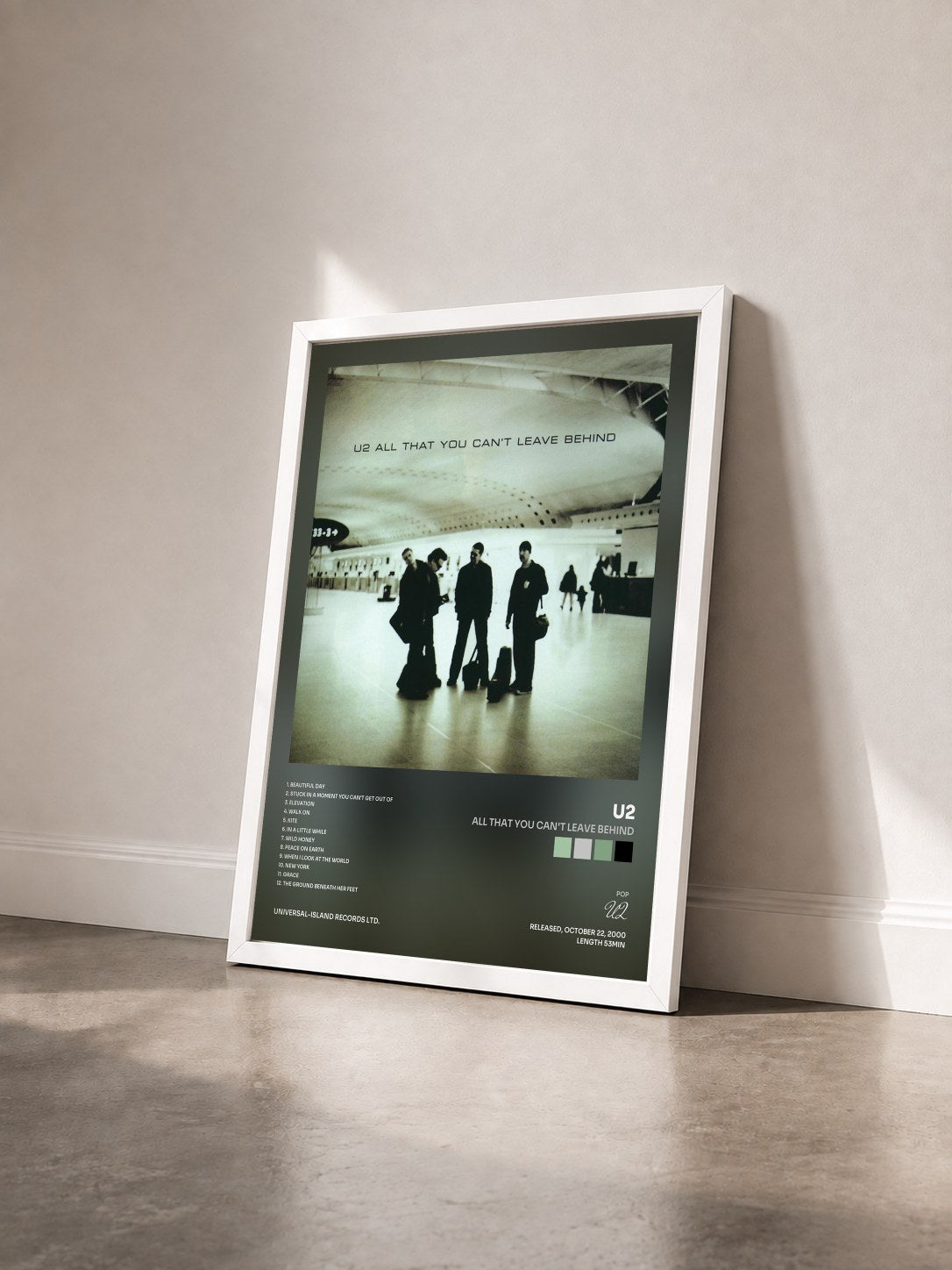 #blanc Tableau de l'album All That You Can't Leave Behind de U2 vu de trois quarts, cadre blanc