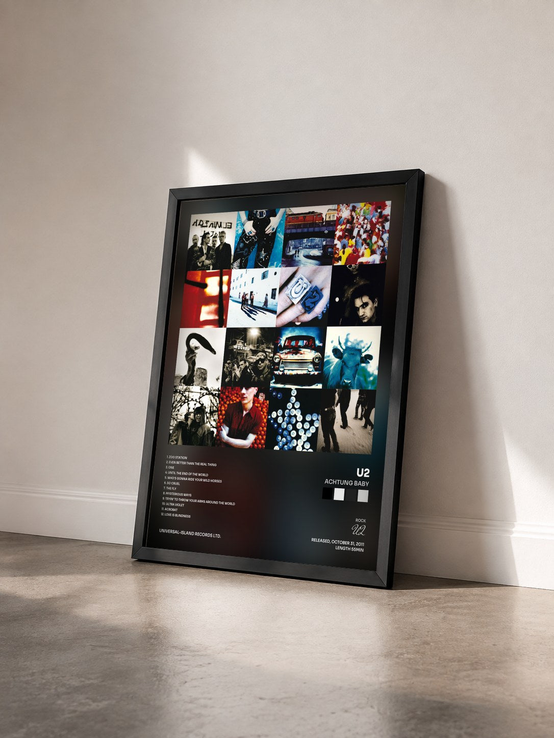 #noir Achtung Baby by U2 as a framed art print seen at an angle, black frame