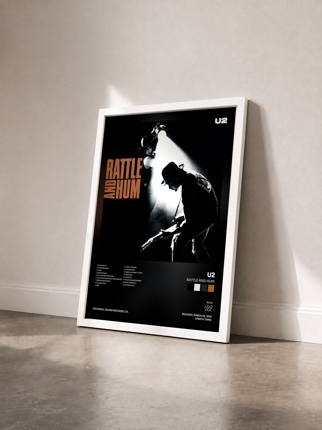 #blanc Rattle And Hum by U2 as a framed art print seen at an angle, white frame
