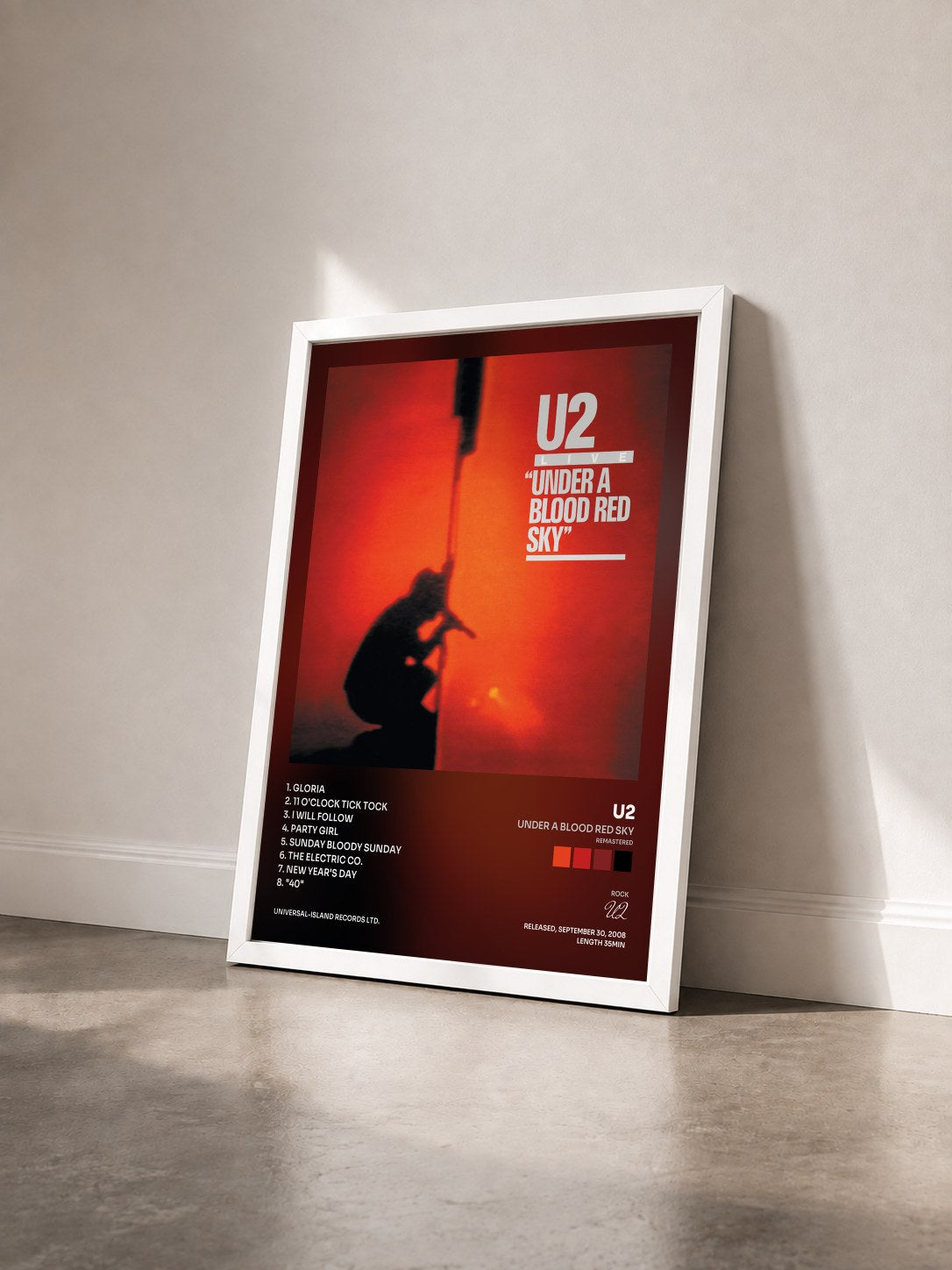 #blanc Tableau de l'album Under A Blood Red Sky (Remastered) de U2 vu de trois quarts, cadre blanc