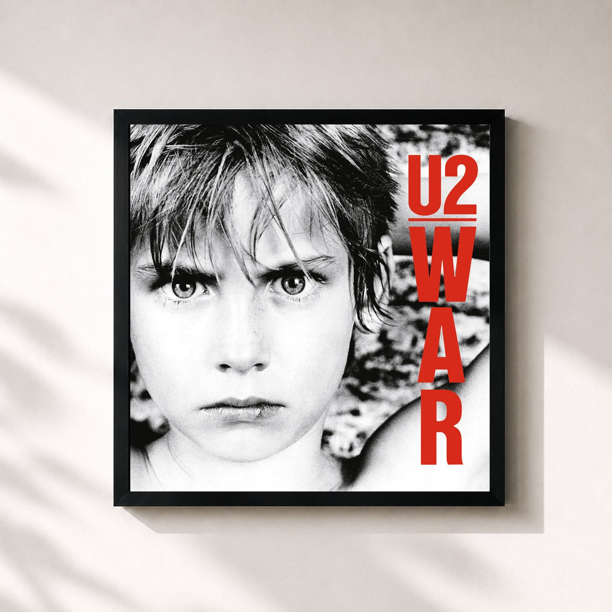 #noir War (Remastered) by U2 as a square framed art print, black 32x32 cm frame