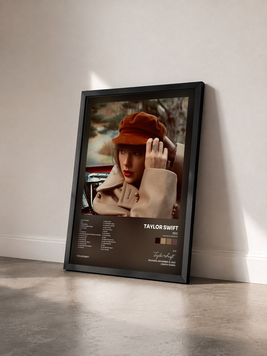 #noir Red (Taylor's Version) by Taylor Swift as a framed art print seen at an angle, black frame