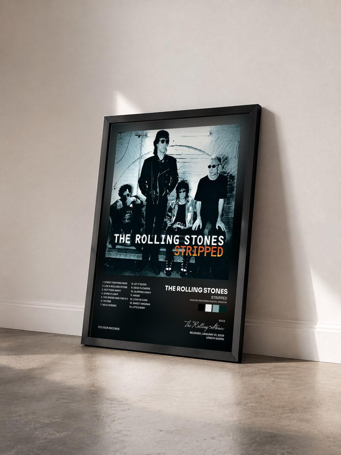 #noir Tableau de l'album Stripped (2009 Re-Mastered Digital Version) de The Rolling Stones vu de trois quarts, cadre noir