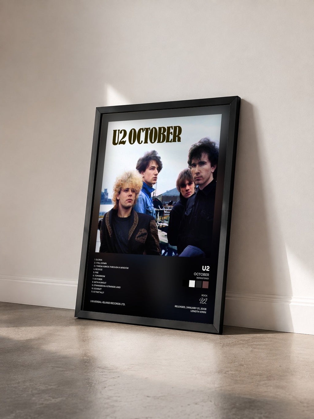 #noir Tableau de l'album October (Remastered) de U2 vu de trois quarts, cadre noir
