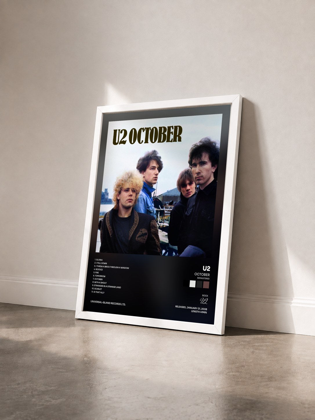 #blanc Tableau de l'album October (Remastered) de U2 vu de trois quarts, cadre blanc
