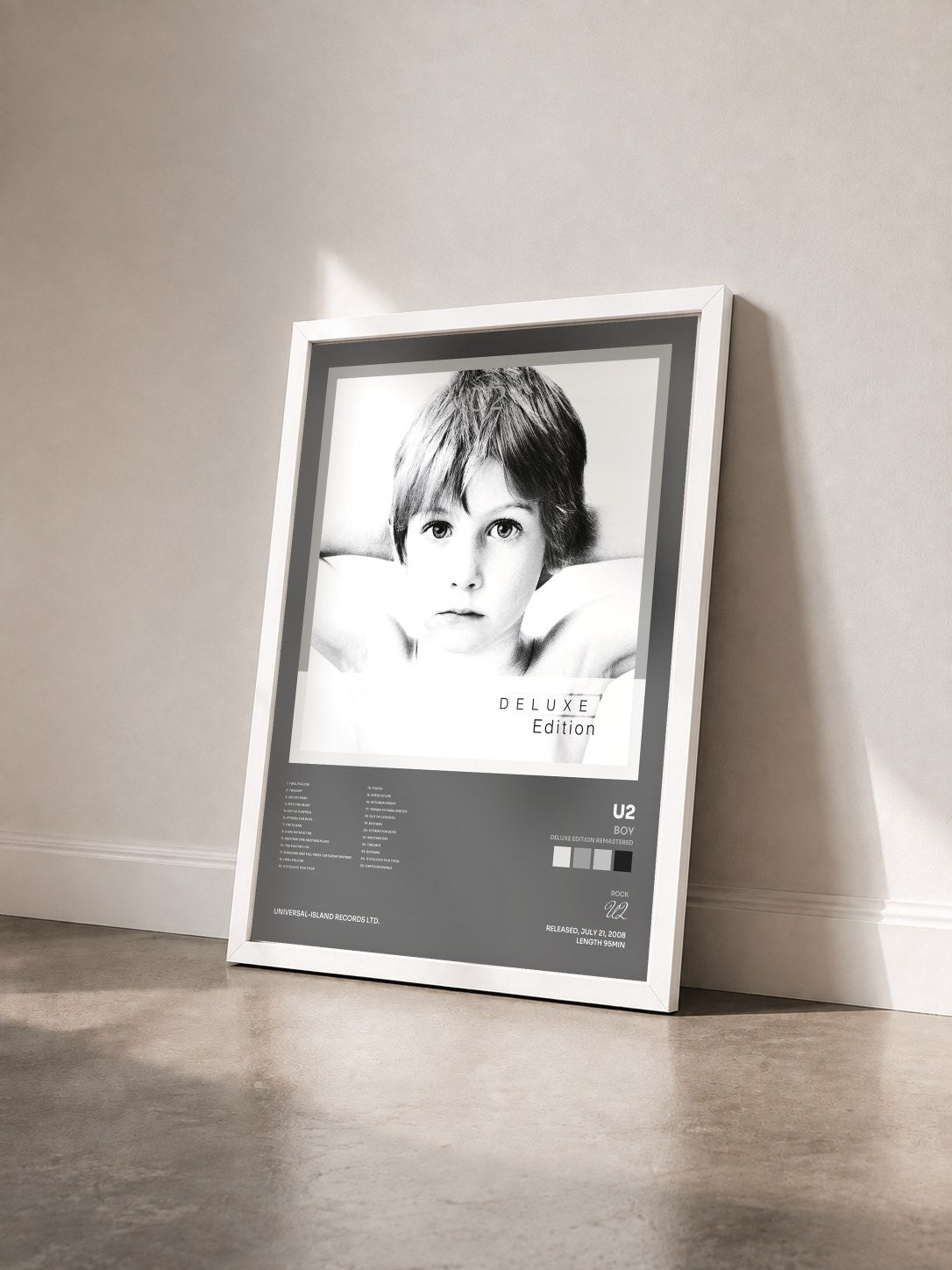 #blanc Tableau de l'album Boy (Deluxe Edition Remastered) de U2 vu de trois quarts, cadre blanc