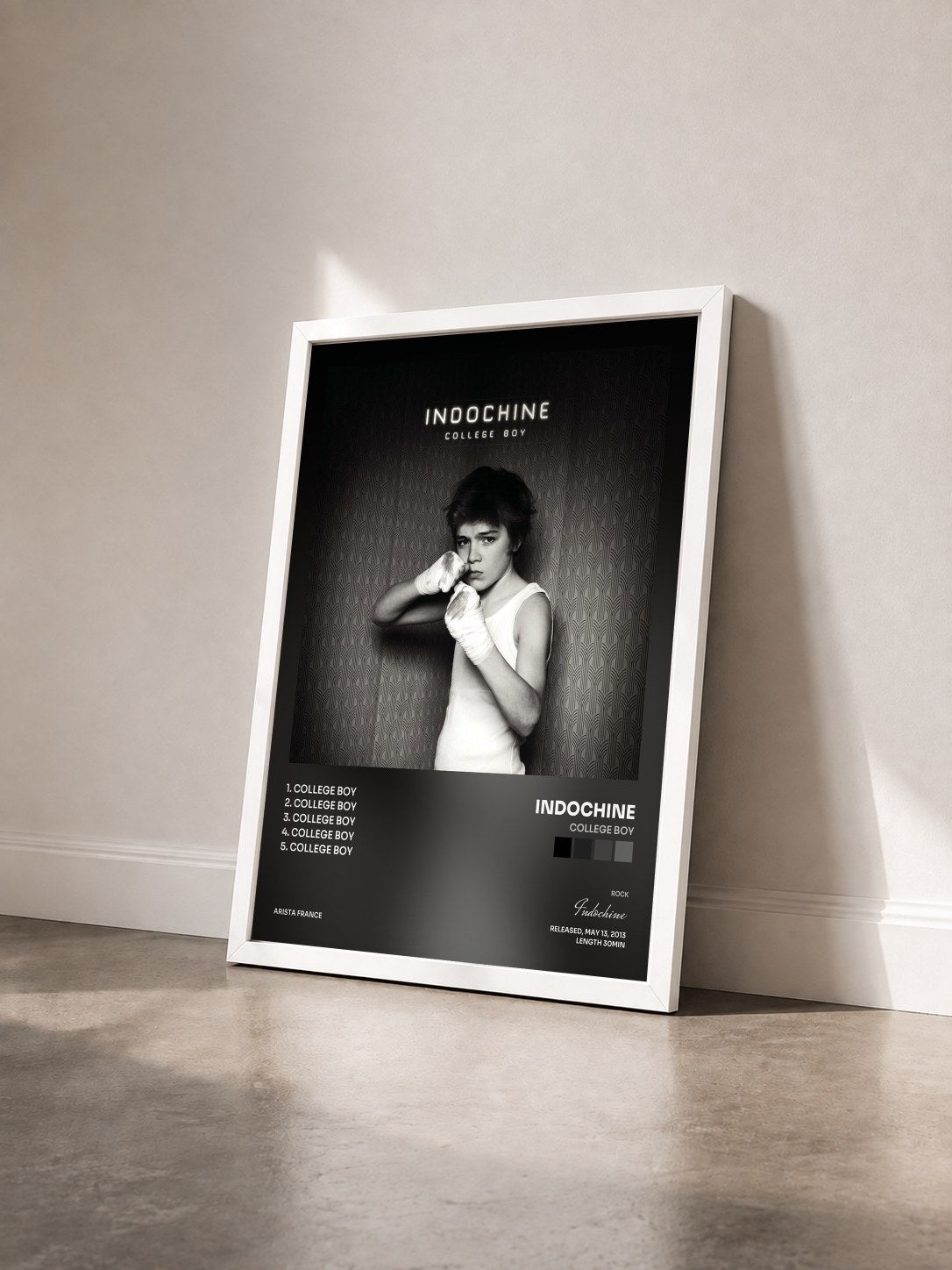 #blanc College Boy by Indochine as a framed art print seen at an angle, white frame
