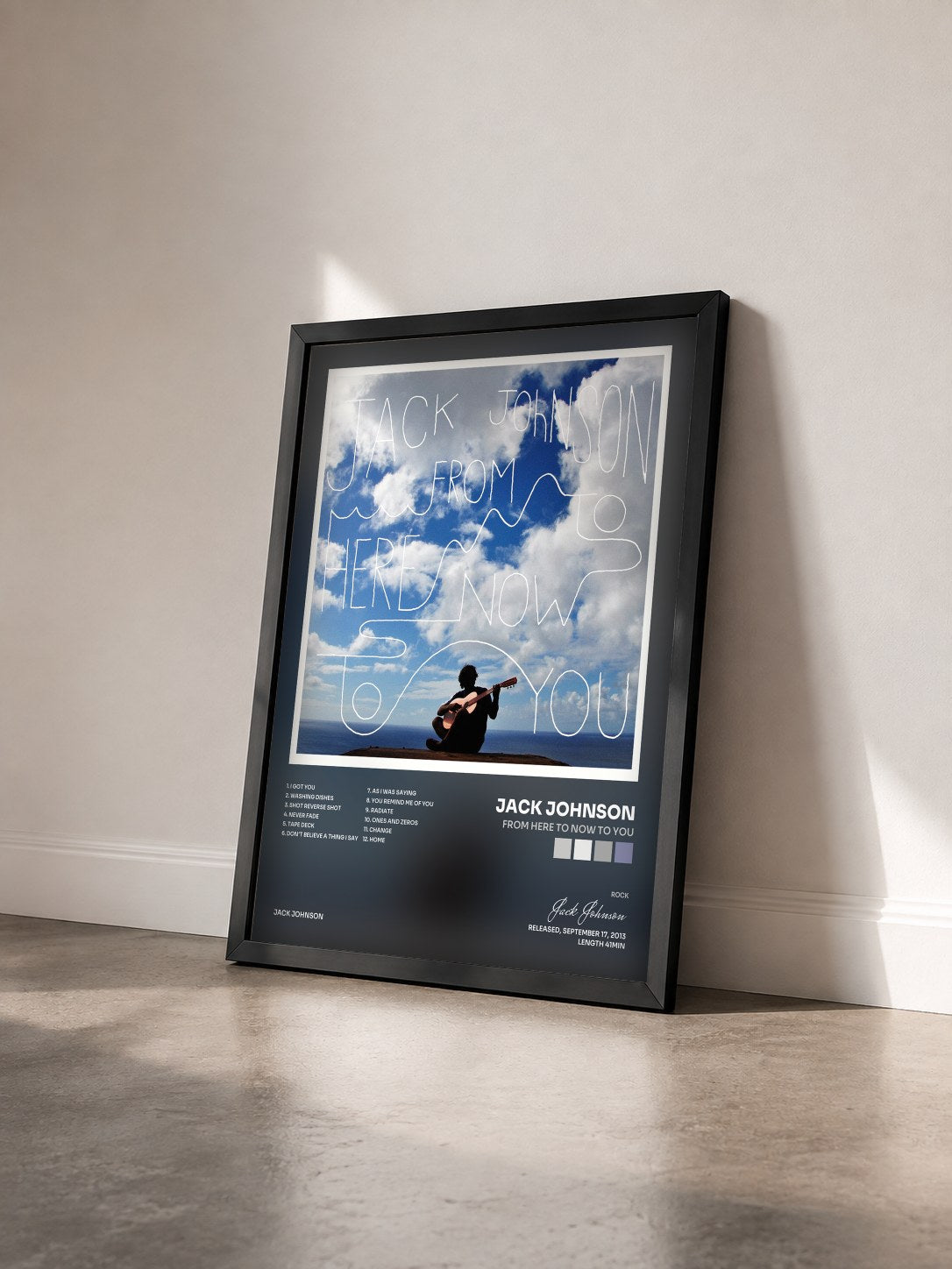 #noir From Here To Now To You by Jack Johnson as a framed art print seen at an angle, black frame