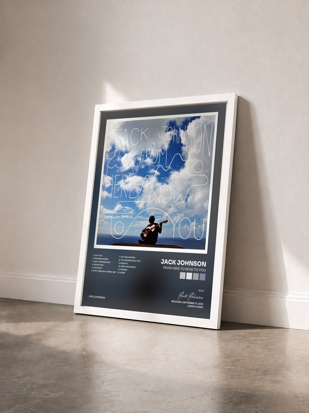 #blanc From Here To Now To You by Jack Johnson as a framed art print seen at an angle, white frame