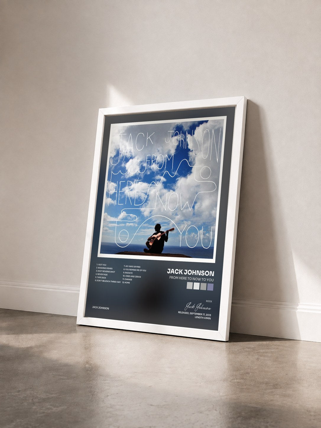 #blanc From Here To Now To You by Jack Johnson as a framed art print seen at an angle, white frame