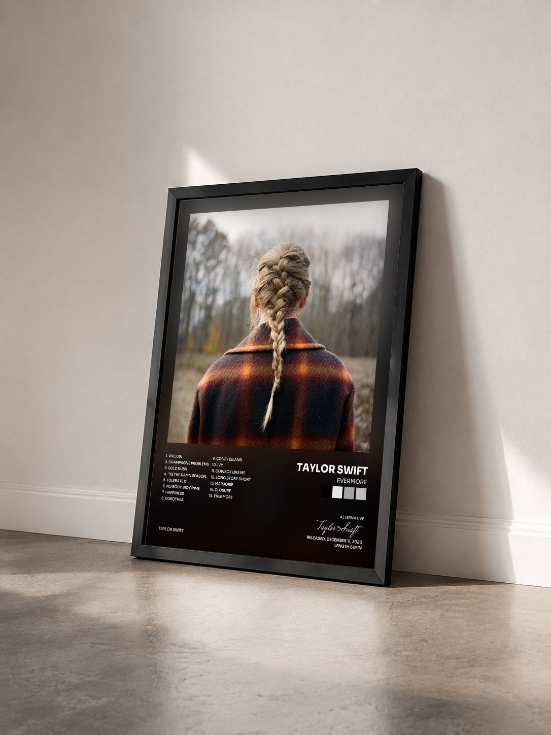 #noir evermore by Taylor Swift as a framed art print seen at an angle, black frame