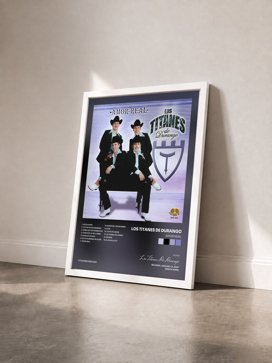 #blanc Tableau de l'album Amor Real de Los Titanes De Durango vu de trois quarts, cadre blanc
