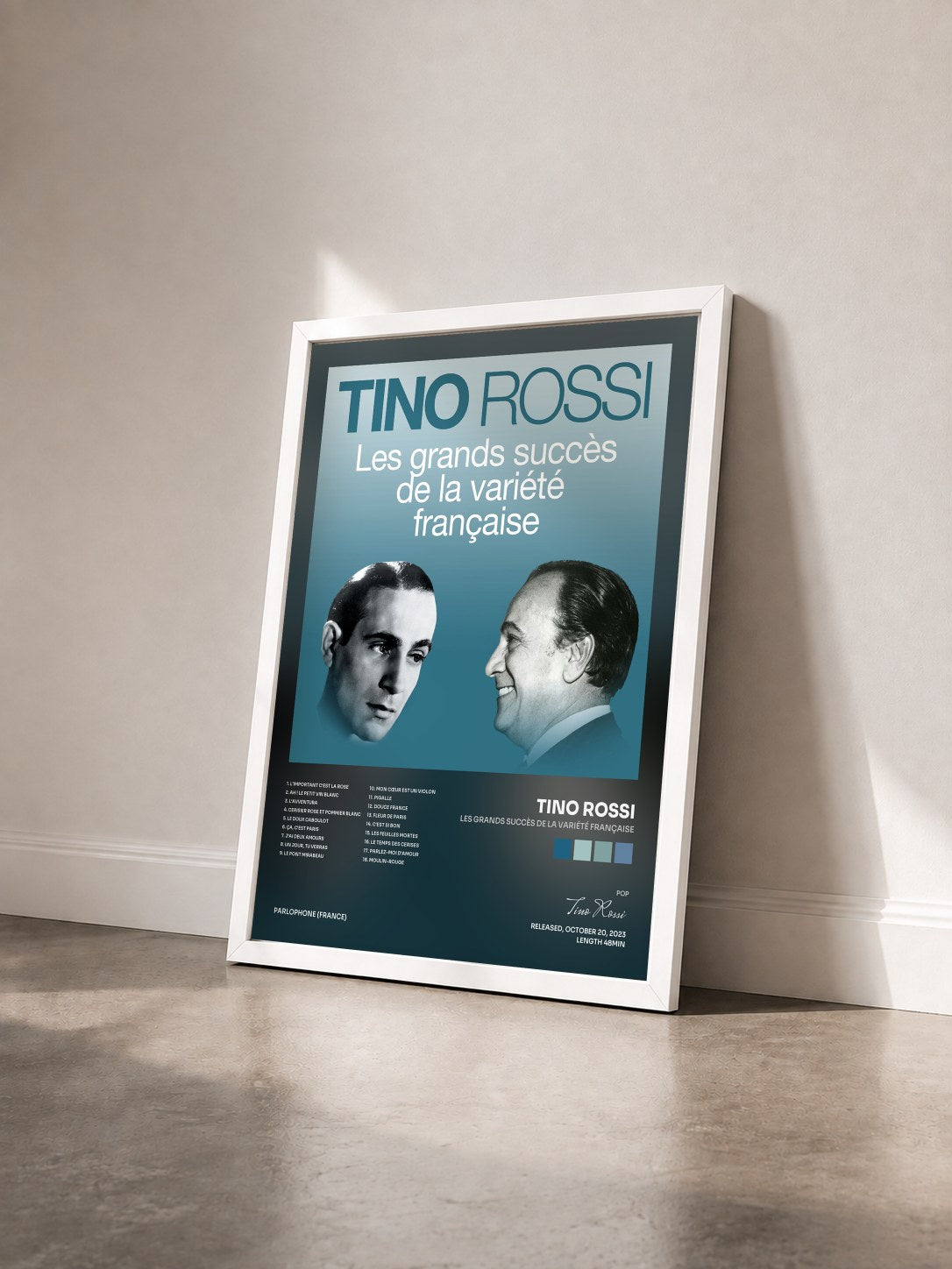 #blanc Tableau de l'album Les grands succès de la variété française de Tino Rossi vu de trois quarts, cadre blanc