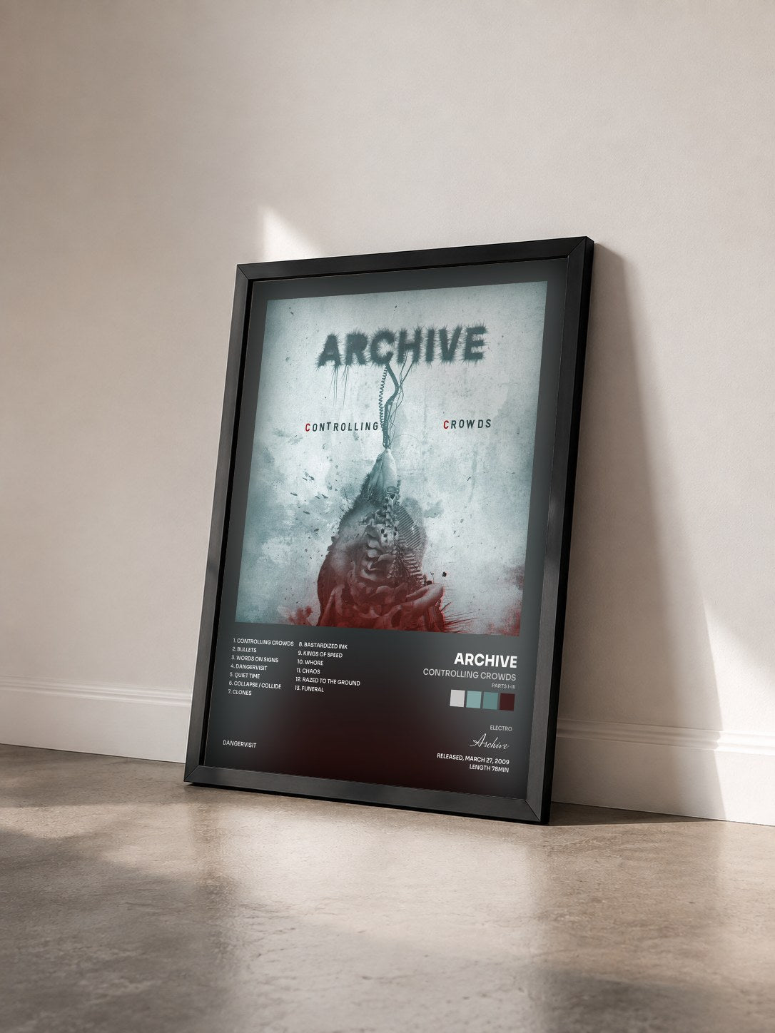 #noir Tableau de l'album Controlling Crowds (Parts I-III) de Archive vu de trois quarts, cadre noir
