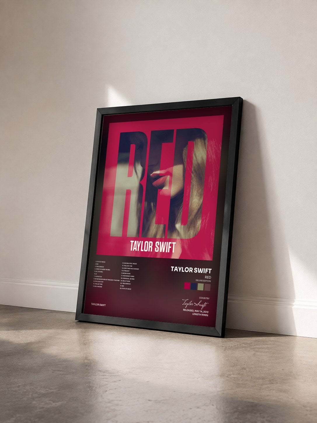 #noir Tableau de l'album Red (Deluxe Edition) de Taylor Swift vu de trois quarts, cadre noir