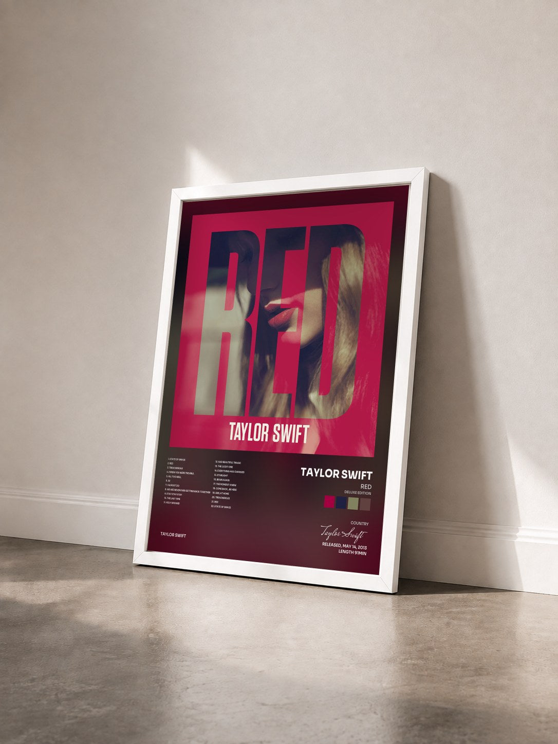 #blanc Tableau de l'album Red (Deluxe Edition) de Taylor Swift vu de trois quarts, cadre blanc