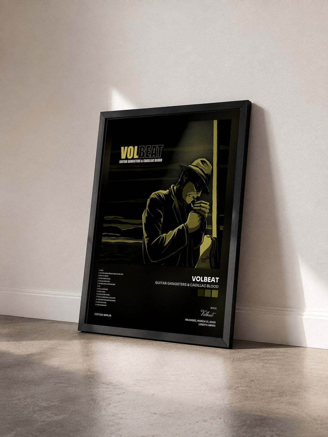 #noir Tableau de l'album Guitar Gangsters & Cadillac Blood de Volbeat vu de trois quarts, cadre noir