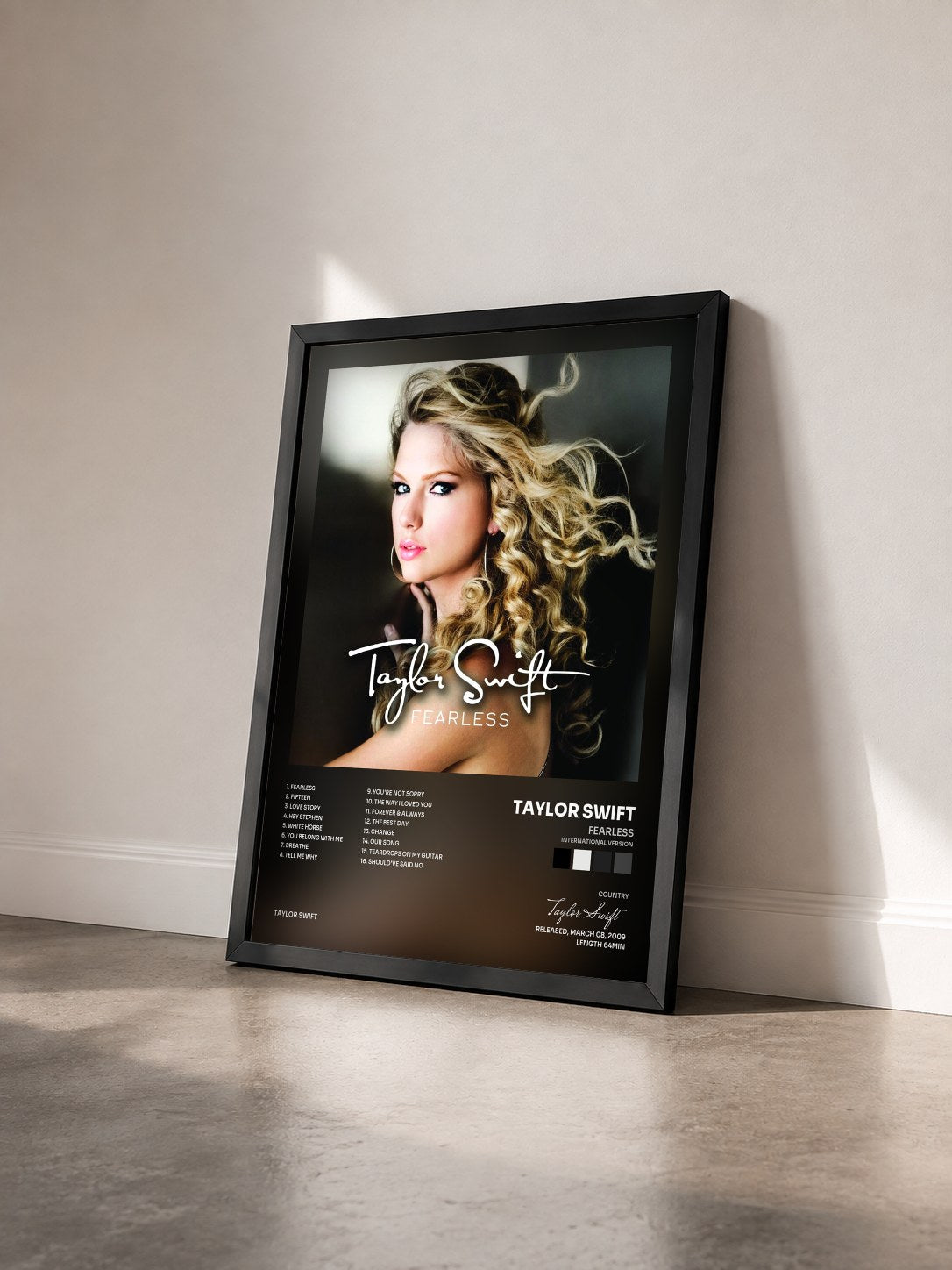 #noir Fearless (International Version) by Taylor Swift as a framed art print seen at an angle, black frame