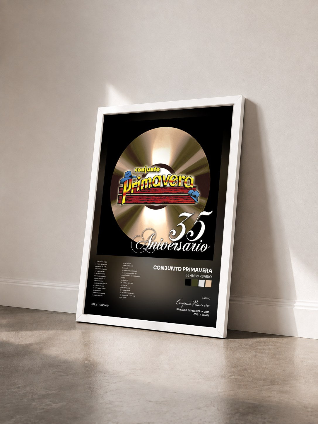 #blanc Tableau de l'album 35 Aniversario de Conjunto Primavera vu de trois quarts, cadre blanc