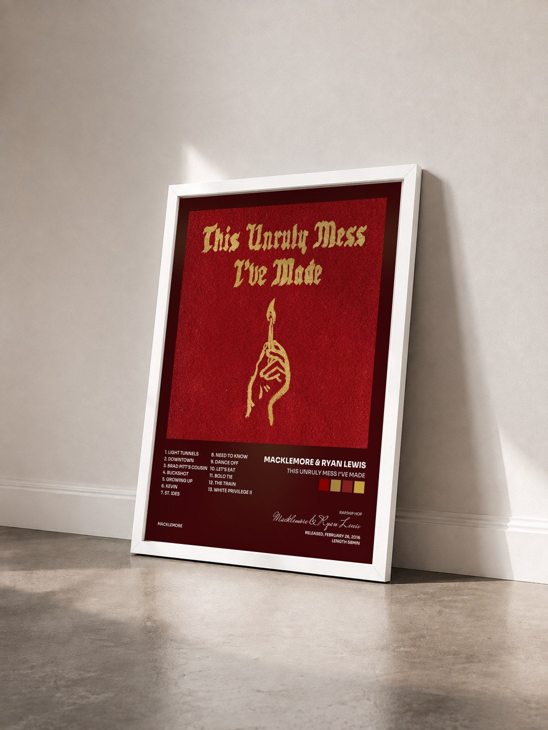 #blanc Tableau de l'album This Unruly Mess I've Made de Macklemore & Ryan Lewis vu de trois quarts, cadre blanc