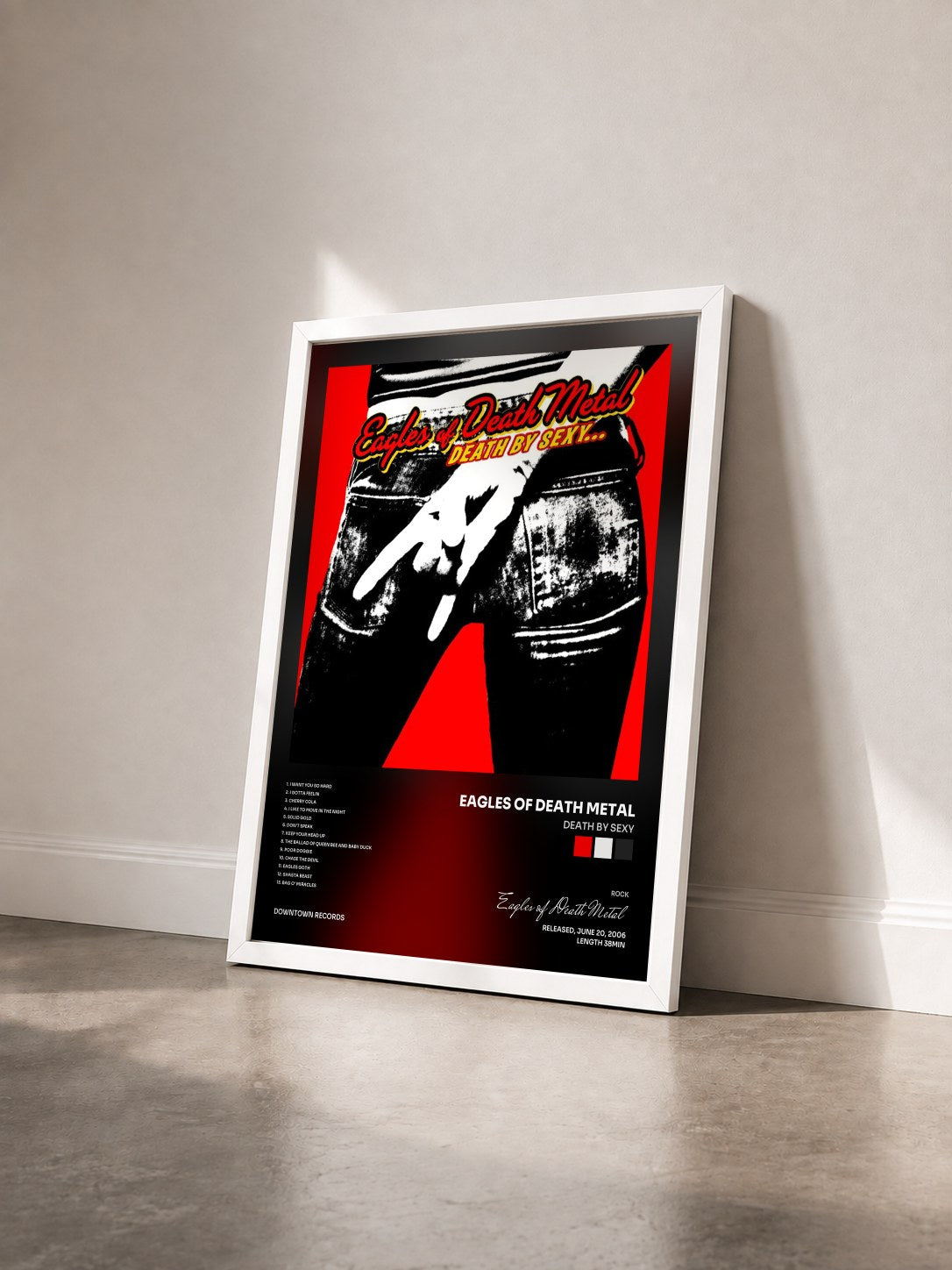 #blanc Tableau de l'album Death By Sexy de Eagles of Death Metal vu de trois quarts, cadre blanc