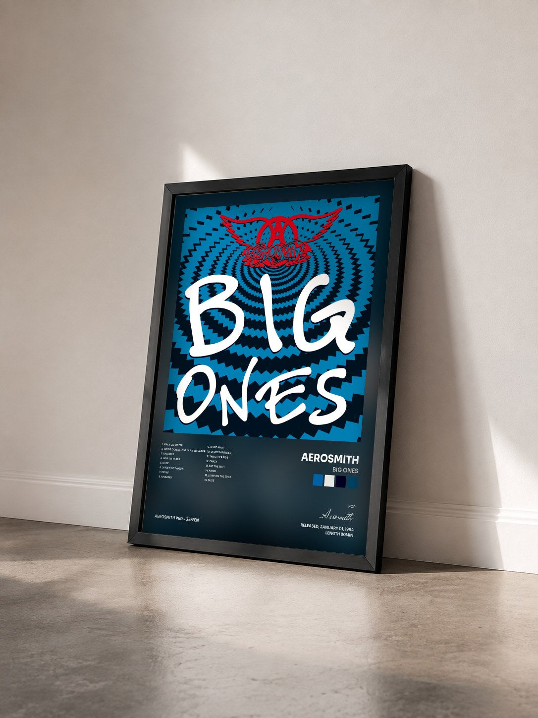 #noir Tableau de l'album Big Ones de Aerosmith vu de trois quarts, cadre noir