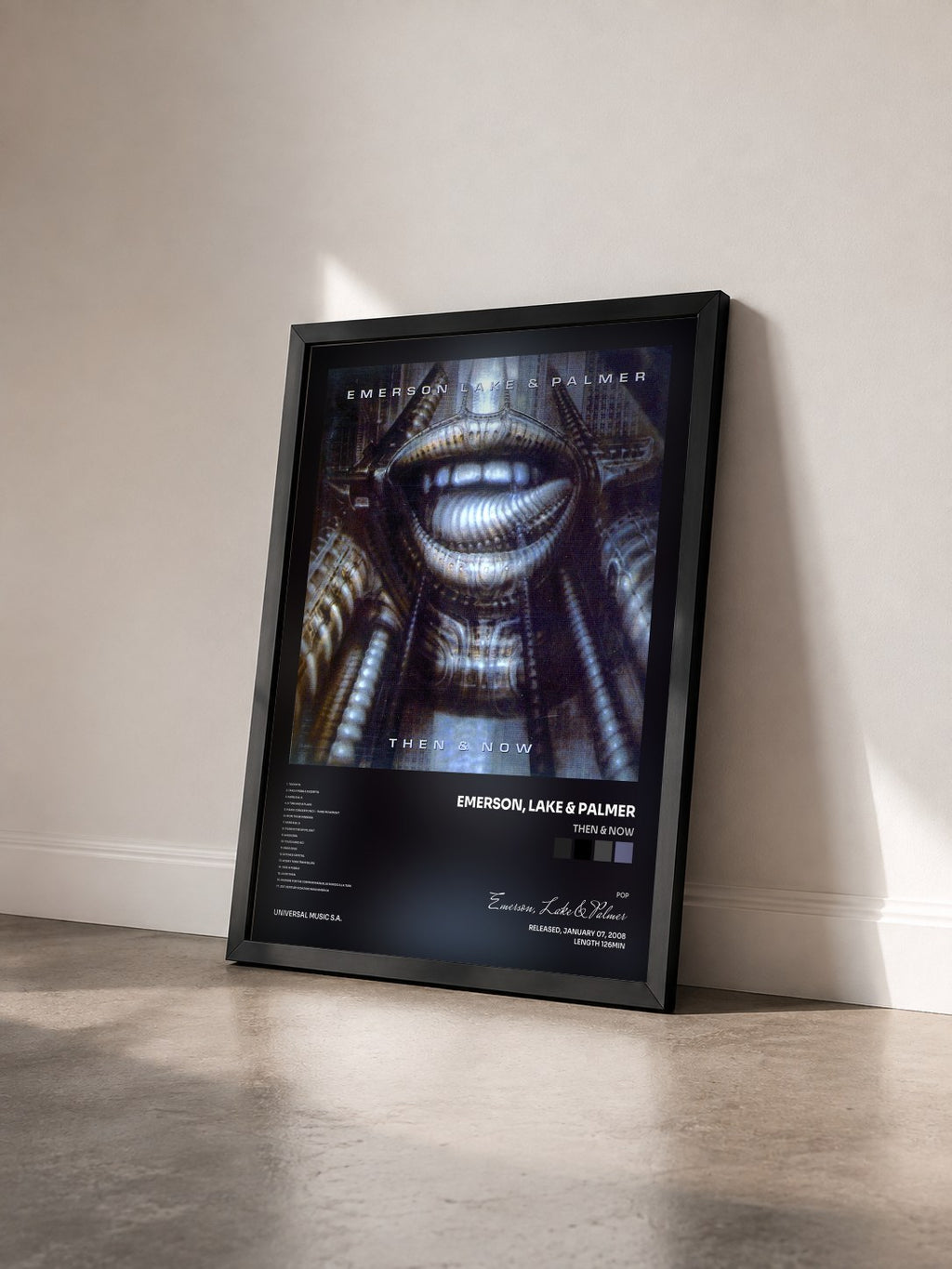 #noir Tableau de l'album Then & Now de Emerson, Lake & Palmer vu de trois quarts, cadre noir