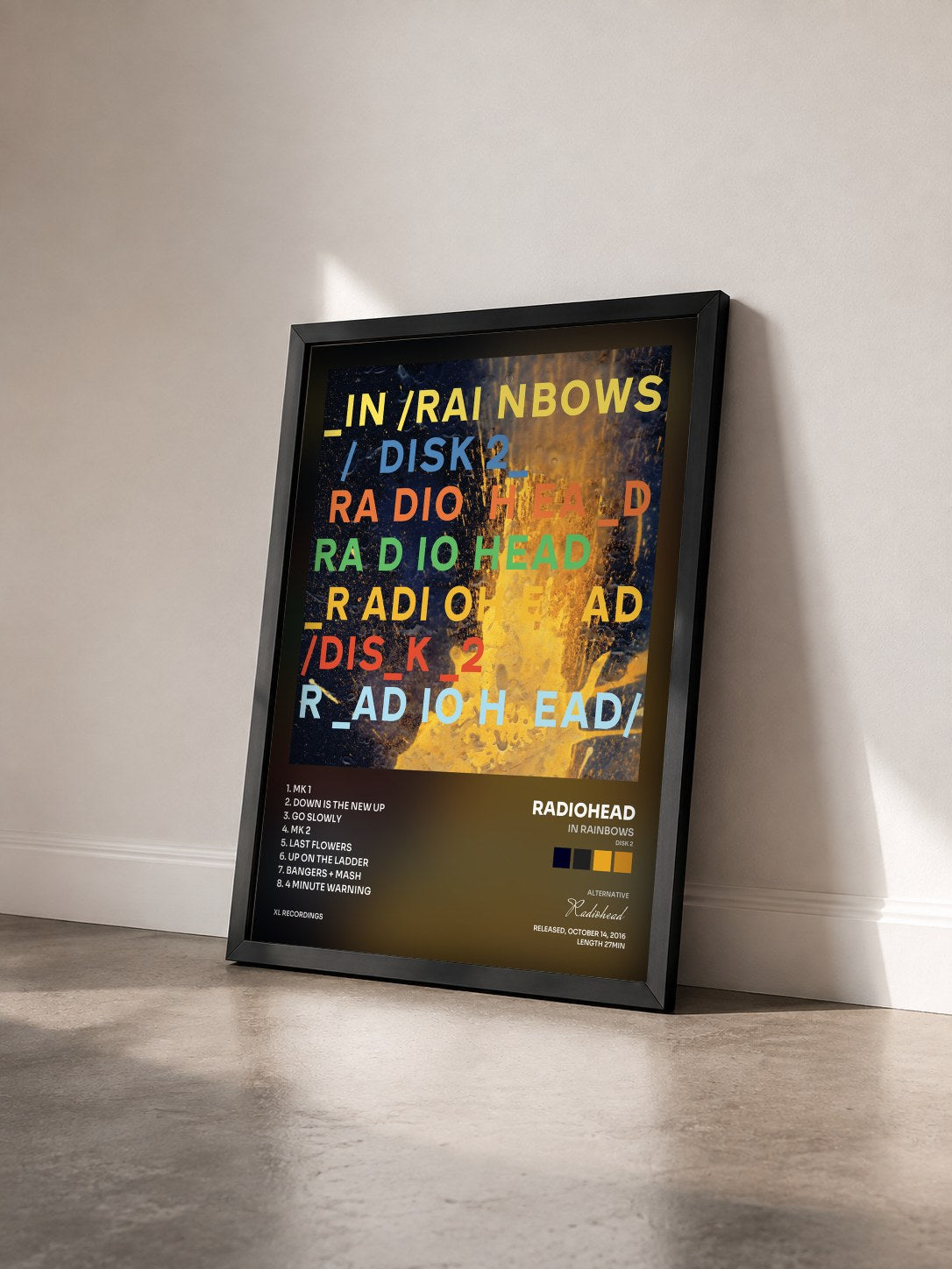 #noir Tableau de l'album In Rainbows (Disk 2) de Radiohead vu de trois quarts, cadre noir