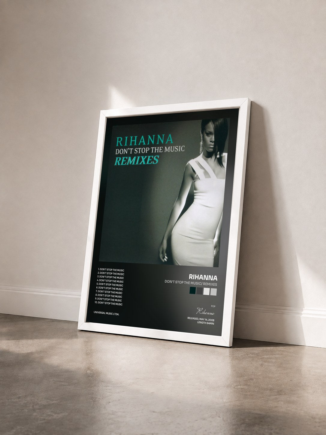 #blanc Tableau de l'album Don't Stop The Music/ Remixes de Rihanna vu de trois quarts, cadre blanc